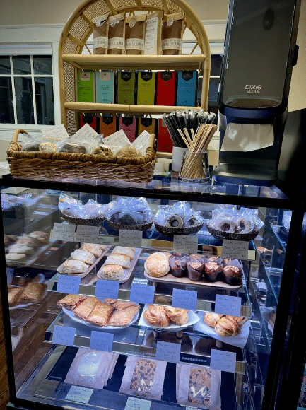 Pastries displayed in a glass case.